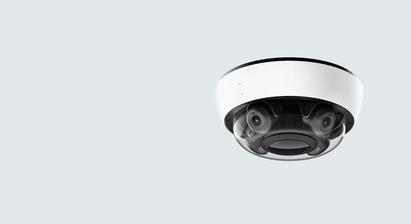 CCTV camera on a light gray background